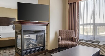 Best Western Plus Red Deer Inn and Suite Room Type - Suite-1 King Bed, Non-Smoking, Mini Suite, Jacuzzi, Fireplace, Sofabed, Microwave And Refrigerator, 