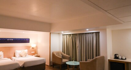 Sarovar Portico Rivera Ahmedabad Room Type - Deluxe Room - 2 Single Beds 25 45SQM Free WiFi Living Area Sarovar Portico Rivera Ahmedabad Room Type - Deluxe Room - 2 Single Beds 25 45SQM Free WiFi Living Area