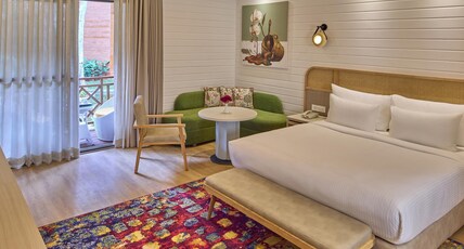 Royal Orchid Resort & Convention Centre Room Type - Wooden Cottages with balcony and Bathtub Royal Orchid Resort & Convention Centre Room Type - Wooden Cottages with balcony and Bathtub