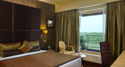 Novotel Hyderabad Airport Room Type - Deluxe Suite with Pool View, Balcony and Lounge Access - Happy Hours 6:30 PM to 8:30 PM Novotel Hyderabad Airport Room Type - Deluxe Suite with Pool View, Balcony and Lounge Access - Happy Hours 6:30 PM to 8:30 PM