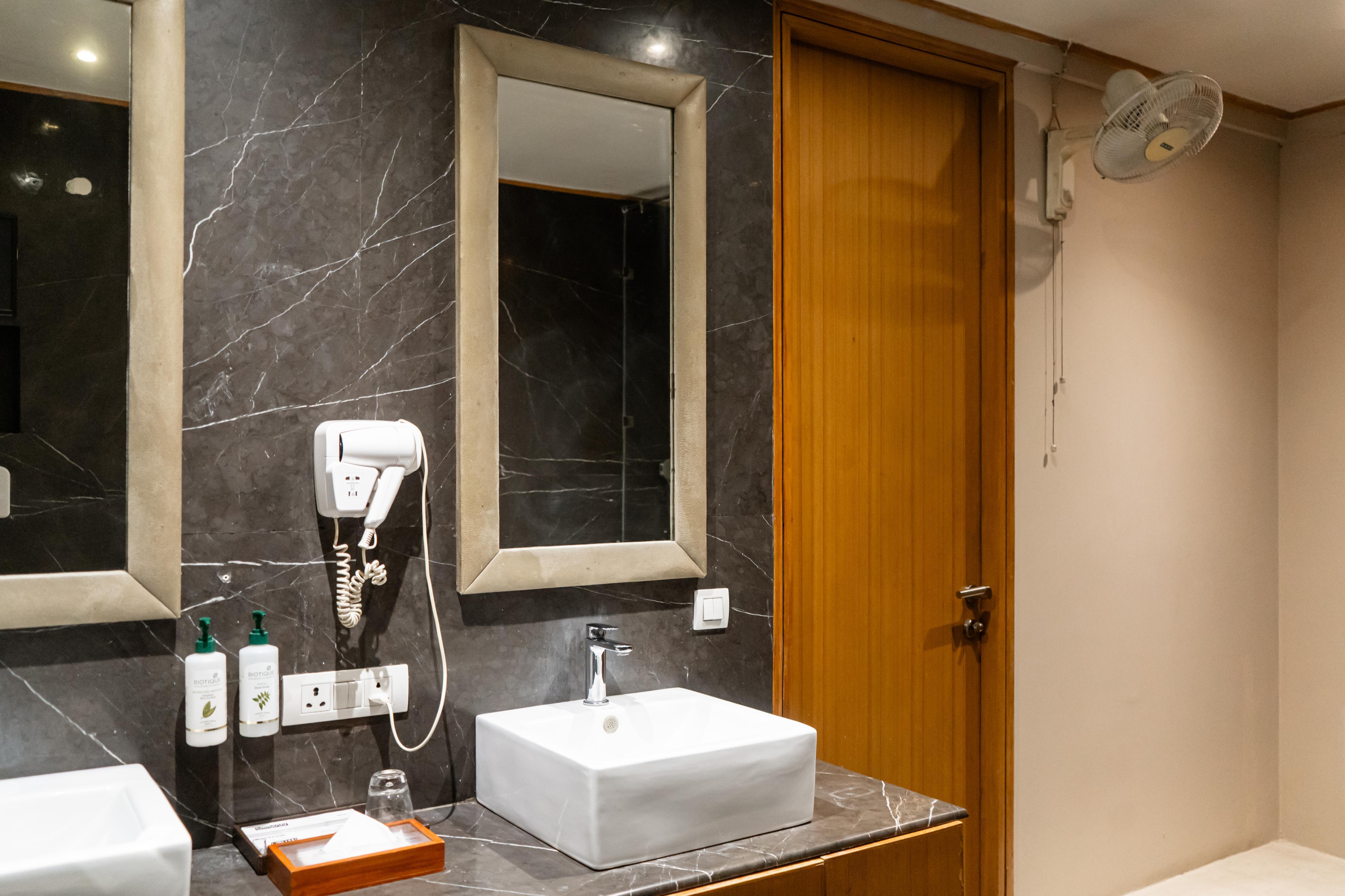 Udman Hotel, Panchshila Park - Tap to explore photos