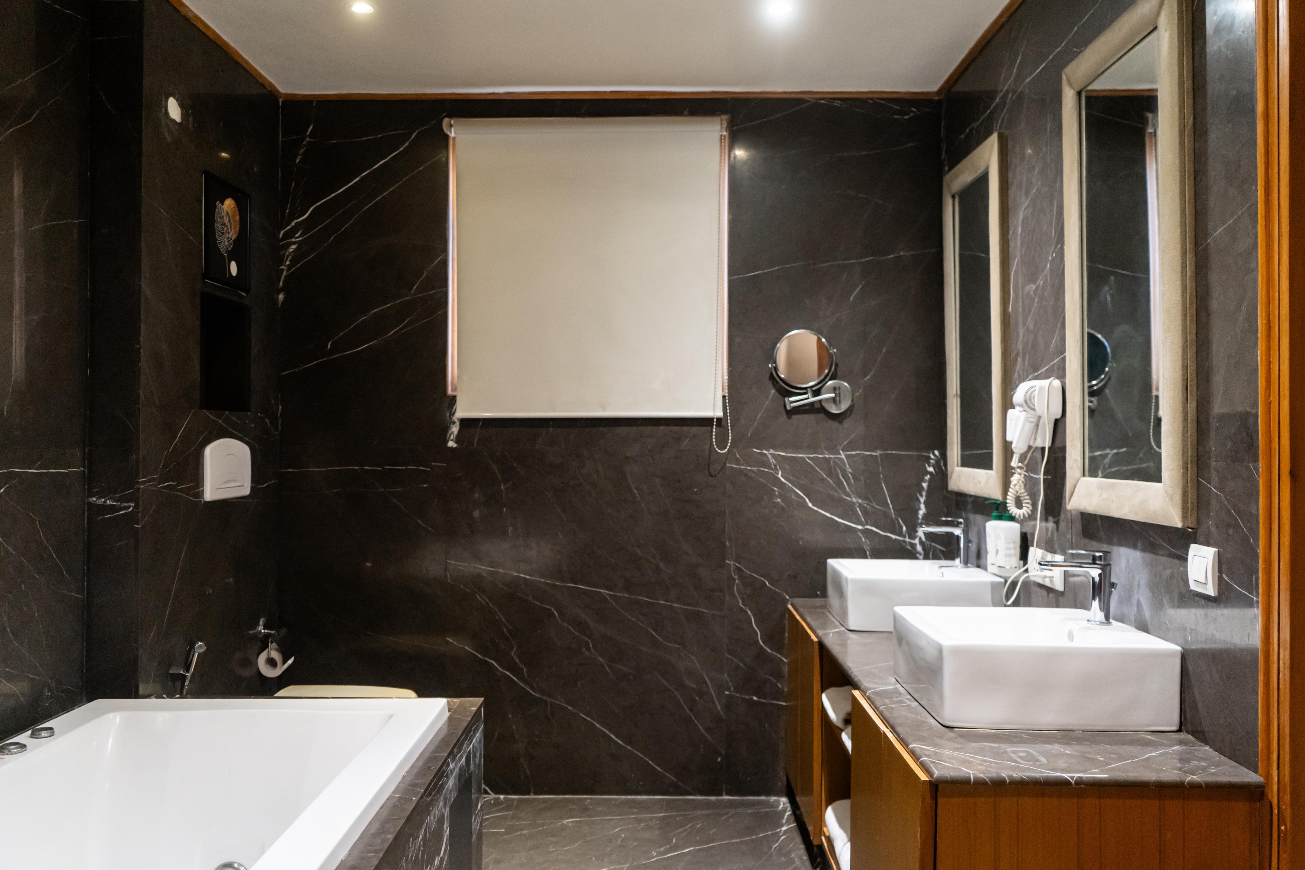 Udman Hotel, Panchshila Park - Tap to explore photos