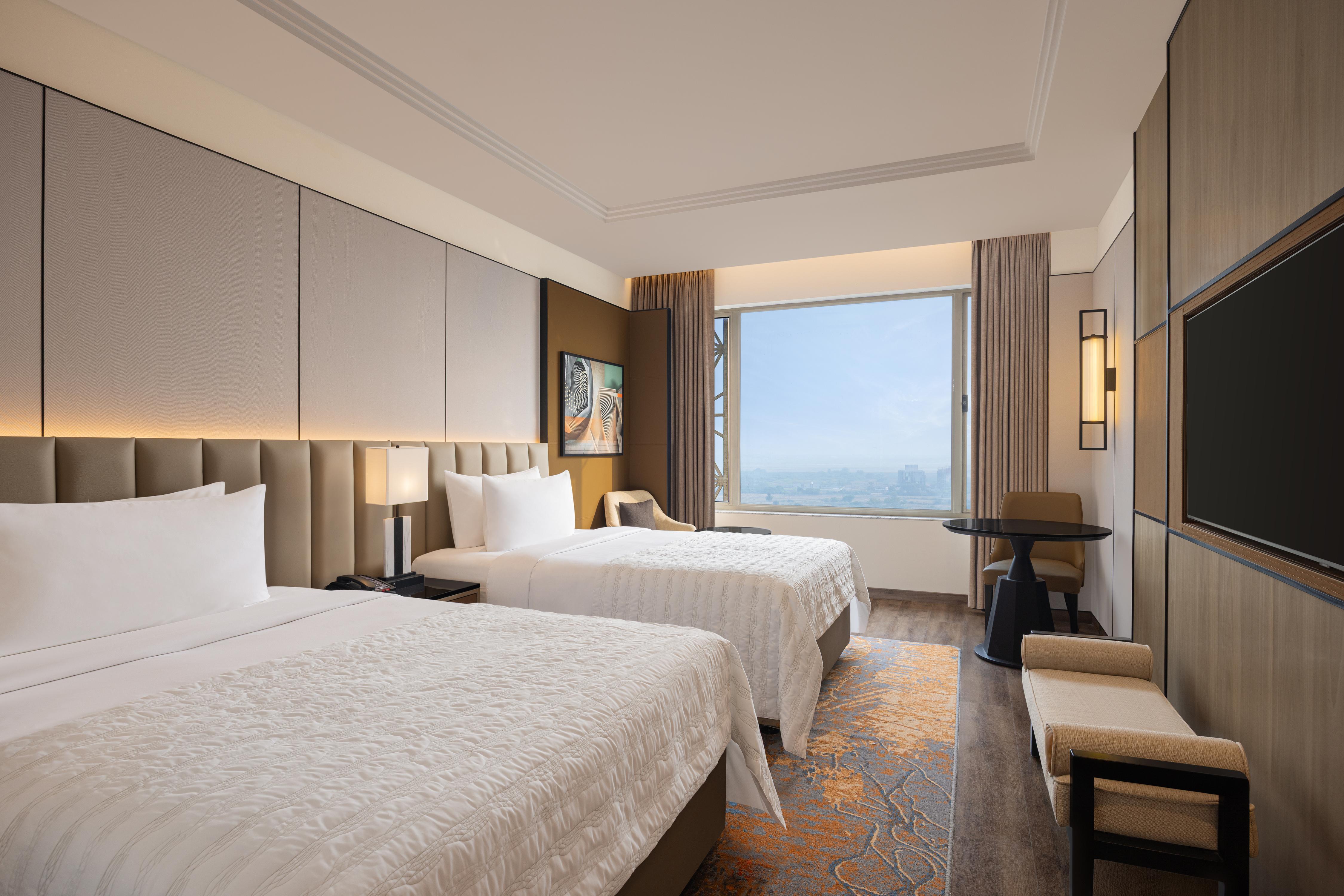 ORANGE MEGASTRUCTURE LLP Room Type - Premier Twin, Atrium View