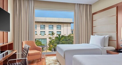 Courtyard by Marriott Kochi Airport Room Type - Executive Twin Pool View with Seating Area and Lounge Access Courtyard by Marriott Kochi Airport Room Type - Executive Twin Pool View with Seating Area and Lounge Access