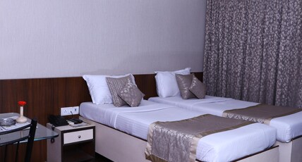 Bharat Avenue Room Type - Deluxe AC Room