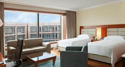 Hilton Bangalore Embassy GolfLinks Room Type - Twin Studio Pool Or Golf View Kitchenette with Bathtub Hilton Bangalore Embassy GolfLinks Room Type - Twin Studio Pool Or Golf View Kitchenette with Bathtub