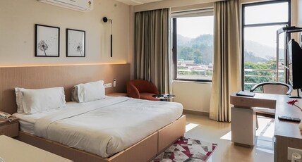 Hotel Yog Vashishth (Near Parmarth Niketan) Room Type - Premier Plus Room with balcony and mountain view Hotel Yog Vashishth (Near Parmarth Niketan) Room Type - Premier Plus Room with balcony and mountain view