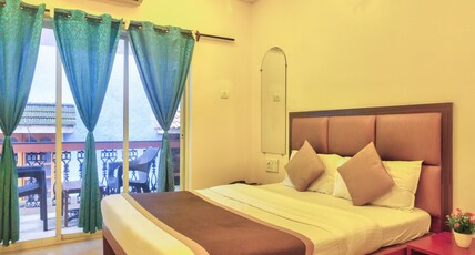 Purushottam Residency Room Type - Deluxe room