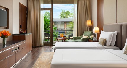 Taj Damdama Lake Resort & Spa, Gurugram Room Type - Luxury Room Courtyard View with Balcony - Twin Bed Taj Damdama Lake Resort & Spa, Gurugram Room Type - Luxury Room Courtyard View with Balcony - Twin Bed