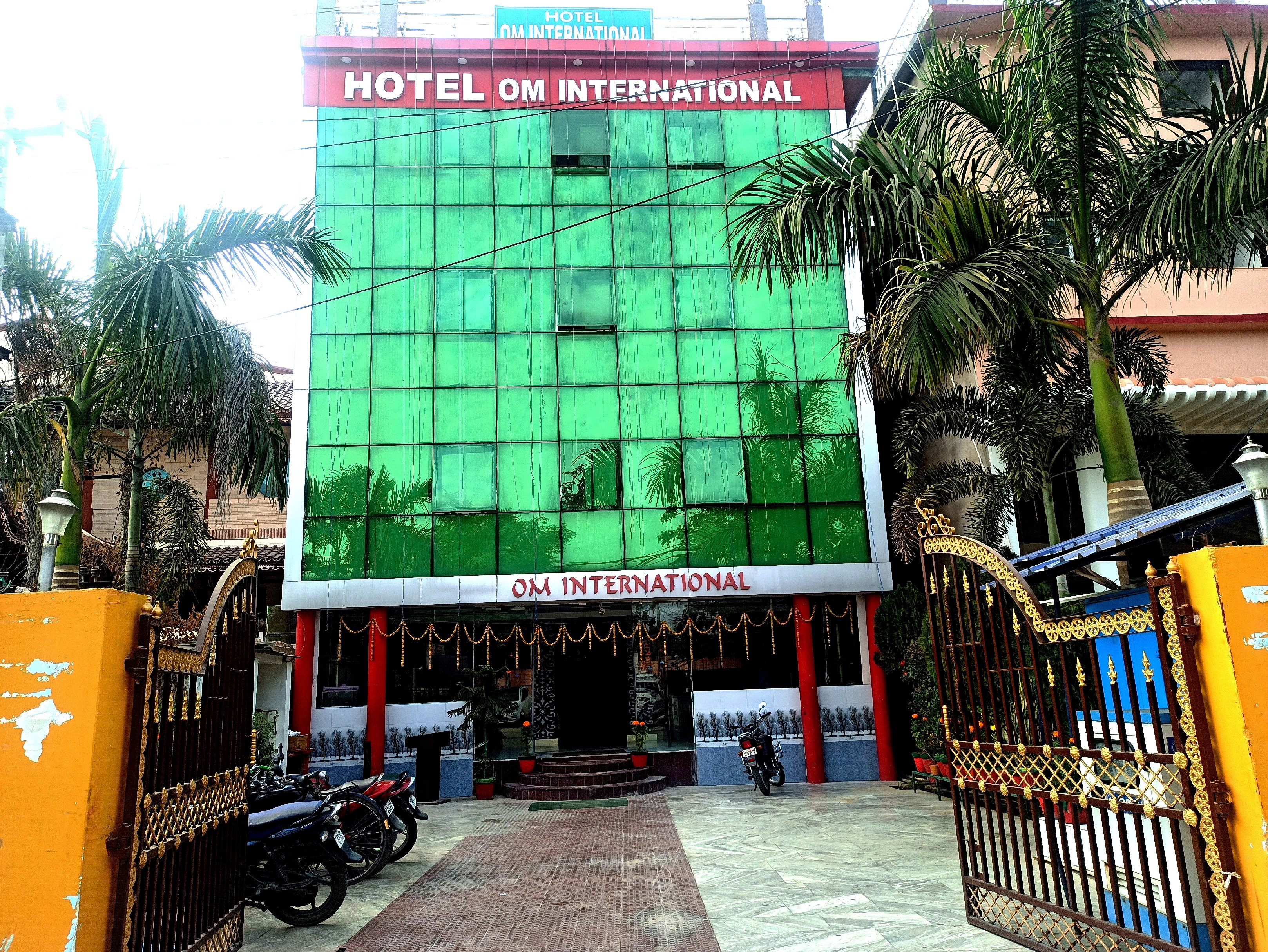 Hotel Om International - Tap to explore photos