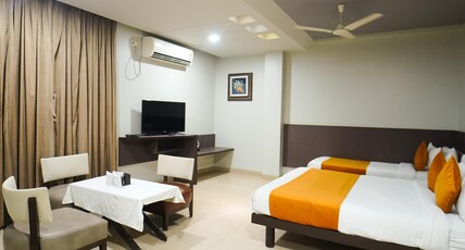 HOTEL POOJA GARDEN AND LODGING Room Type - Deluxe Triple Bed AC Room