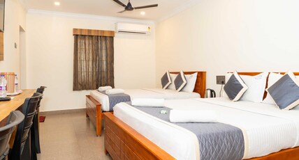 Hotel NNP Grand Room Type - Deluxe Four Bed AC