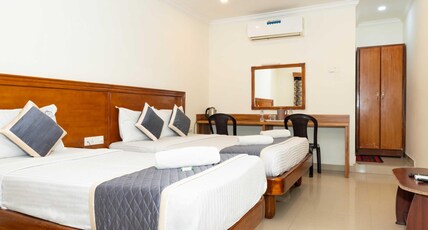 Hotel NNP Grand Room Type - Deluxe Triple Bed AC