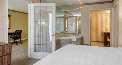 Best Western Plus Genetti Hotel & Conference Center Room Type - Suite-1 King Bed, Non-Smoking, Sofabed, Hot Tub, Living Area, Kitchenette, Wi-Fi, Full Breakfast Best Western Plus Genetti Hotel & Conference Center Room Type - Suite-1 King Bed, Non-Smoking, Sofabed, Hot Tub, Living Area, Kitchenette, Wi-Fi, Full Breakfast