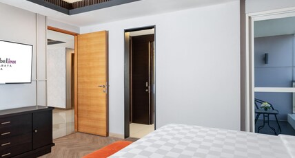 Swiss-Belinn Manyar Room Type - King Suite Room Swiss-Belinn Manyar Room Type - King Suite Room