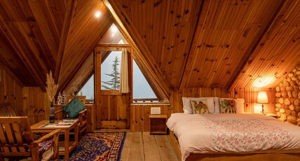 Ishan Log Hut Room Type - Family suite with balcony and snow capped thirthan range mountain view Ishan Log Hut Room Type - Family suite with balcony and snow capped thirthan range mountain view
