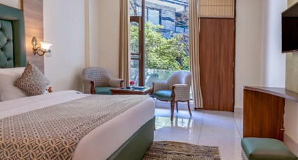 SS Resort ( Centrally heated and Air conditioned) Room Type - Luxury Room with Balcony and Hill View ( Centrally heated and Airconditioned) SS Resort ( Centrally heated and Air conditioned) Room Type - Luxury Room with Balcony and Hill View ( Centrally heated and Airconditioned)
