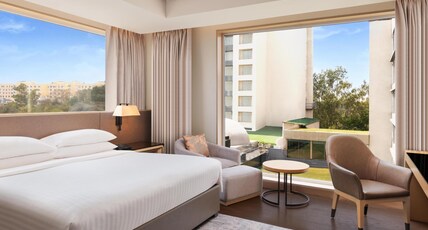Indore Marriott Hotel Room Type - Junior Suite, Club Lounge Access, Happy Hours (1+1) from 6-8PM, 1-Way Airport Transfer, 1 King Bed Indore Marriott Hotel Room Type - Junior Suite, Club Lounge Access, Happy Hours (1+1) from 6-8PM, 1-Way Airport Transfer, 1 King Bed