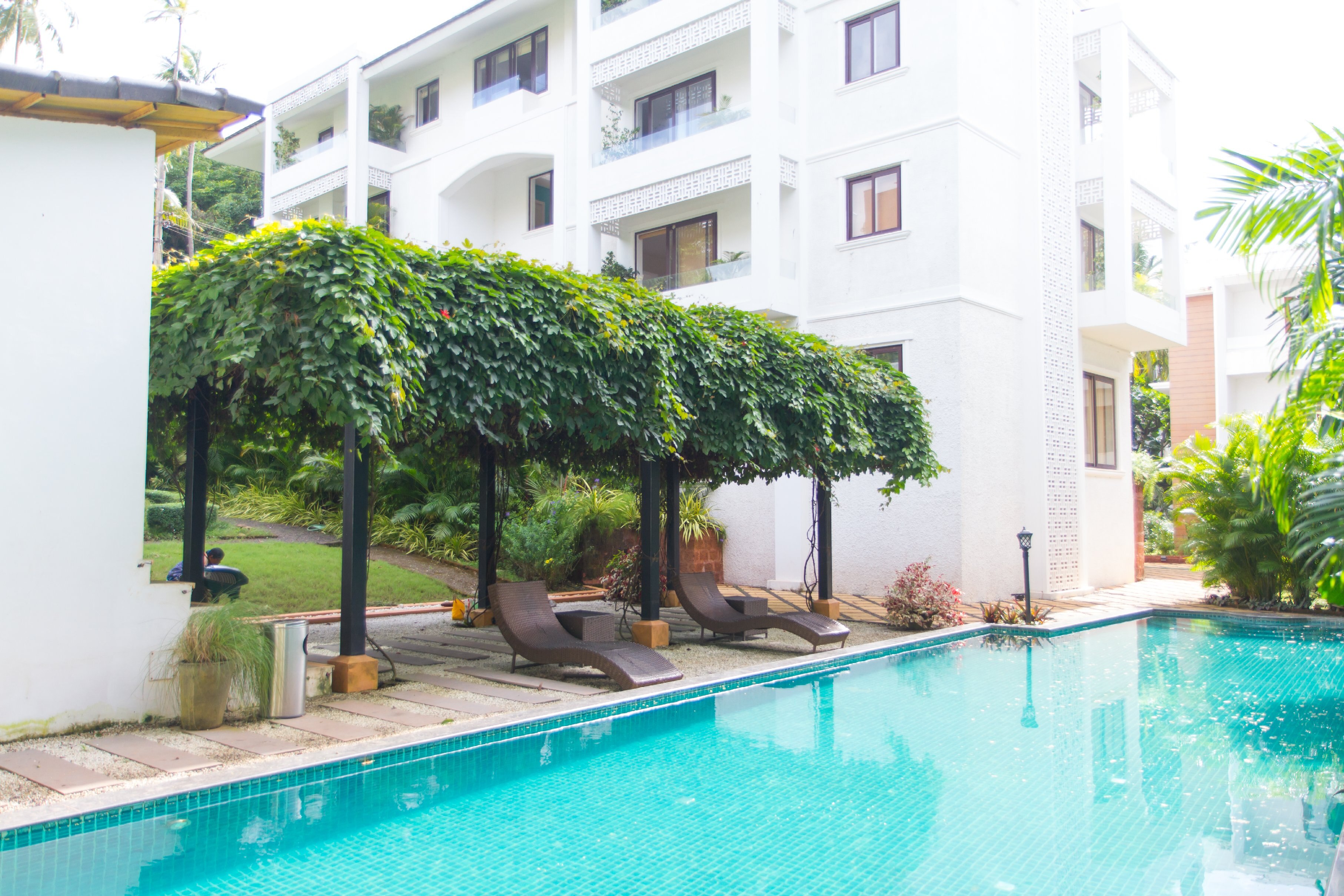 Elegant Pool View 1BHK with Private Patio - Tap to explore photos
