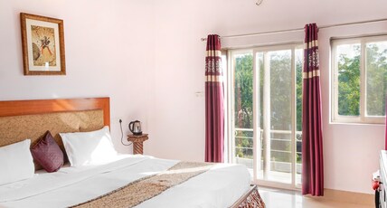 Vikramgarh Lakeview at Fatehsagar| Infinity Pool and Sitout  Room Type - Deluxe Double Room with Balcony