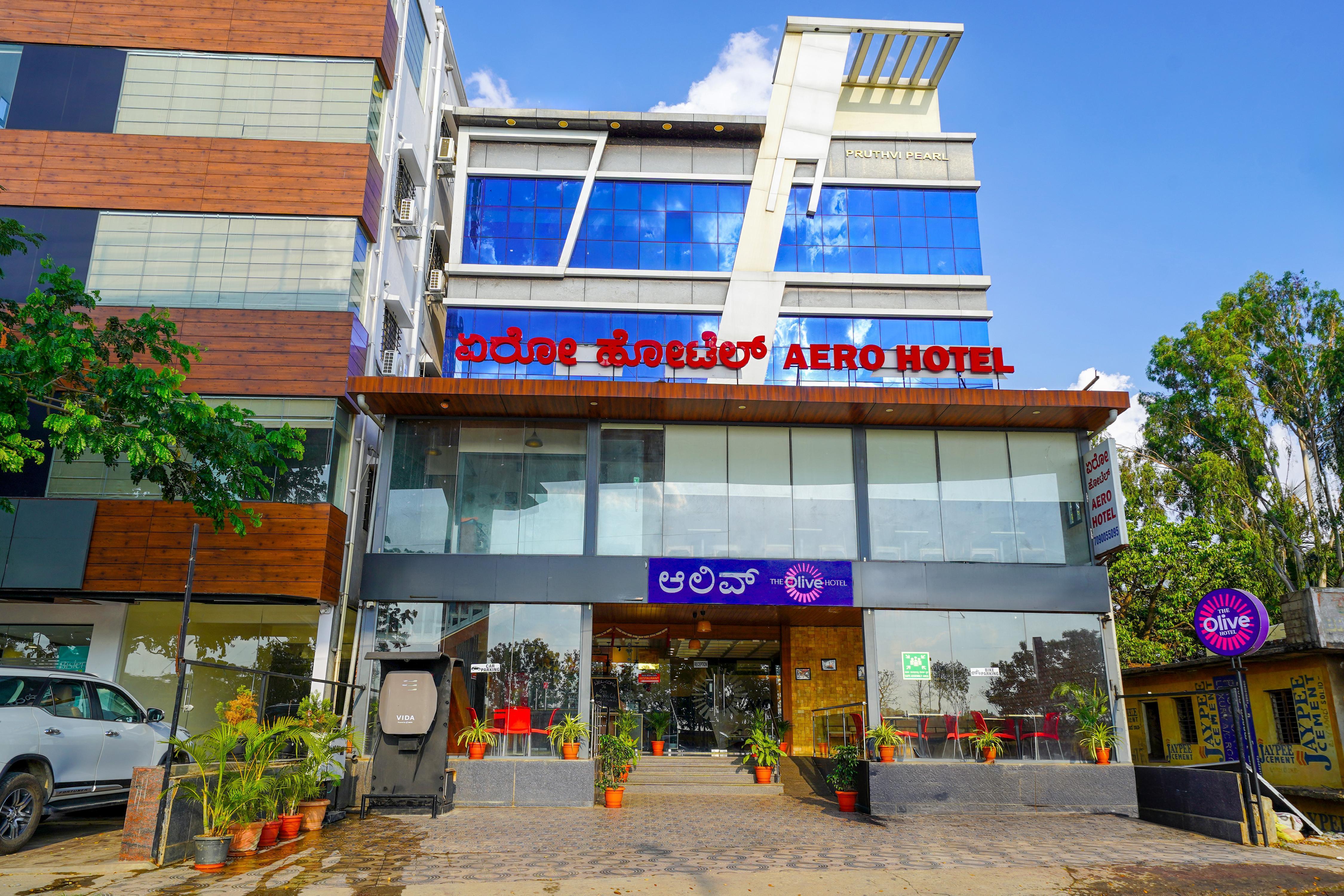Olive Hotel Airport road -  Yelahanka by Embassy Group - Tap to explore photos