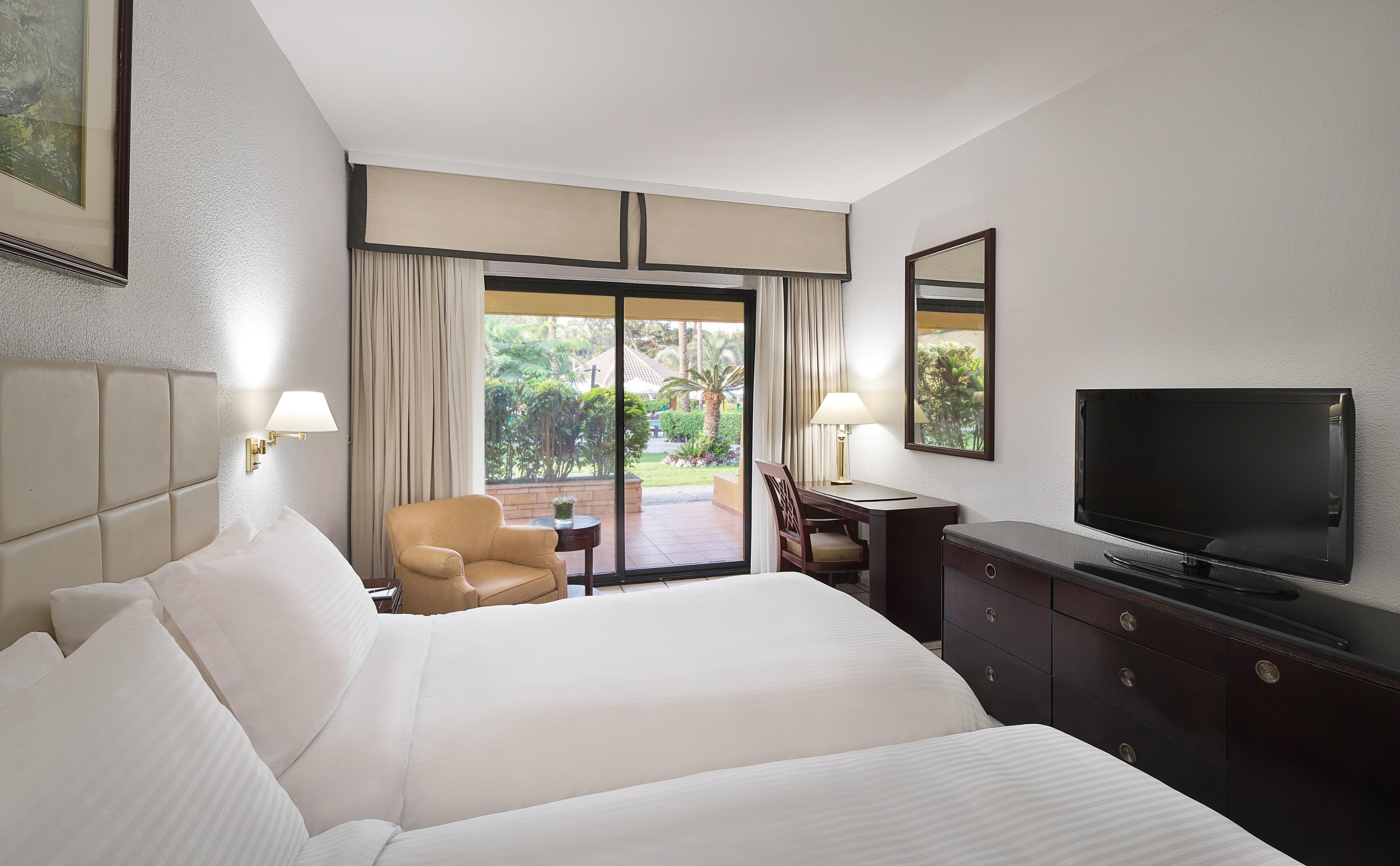 Hilton Cairo Heliopolis Room Type - TWIN POOLSIDE TERRACE ROOM Hilton Cairo Heliopolis Room Type - TWIN POOLSIDE TERRACE ROOM