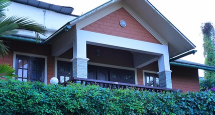 Vythiri Tea Garden Retreat Room Type - Deluxe Room Brick Cottage