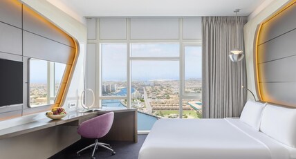 V Hotel Dubai, Curio Collection by Hilton Room Type - Deluxe Room Canal View Exclusive