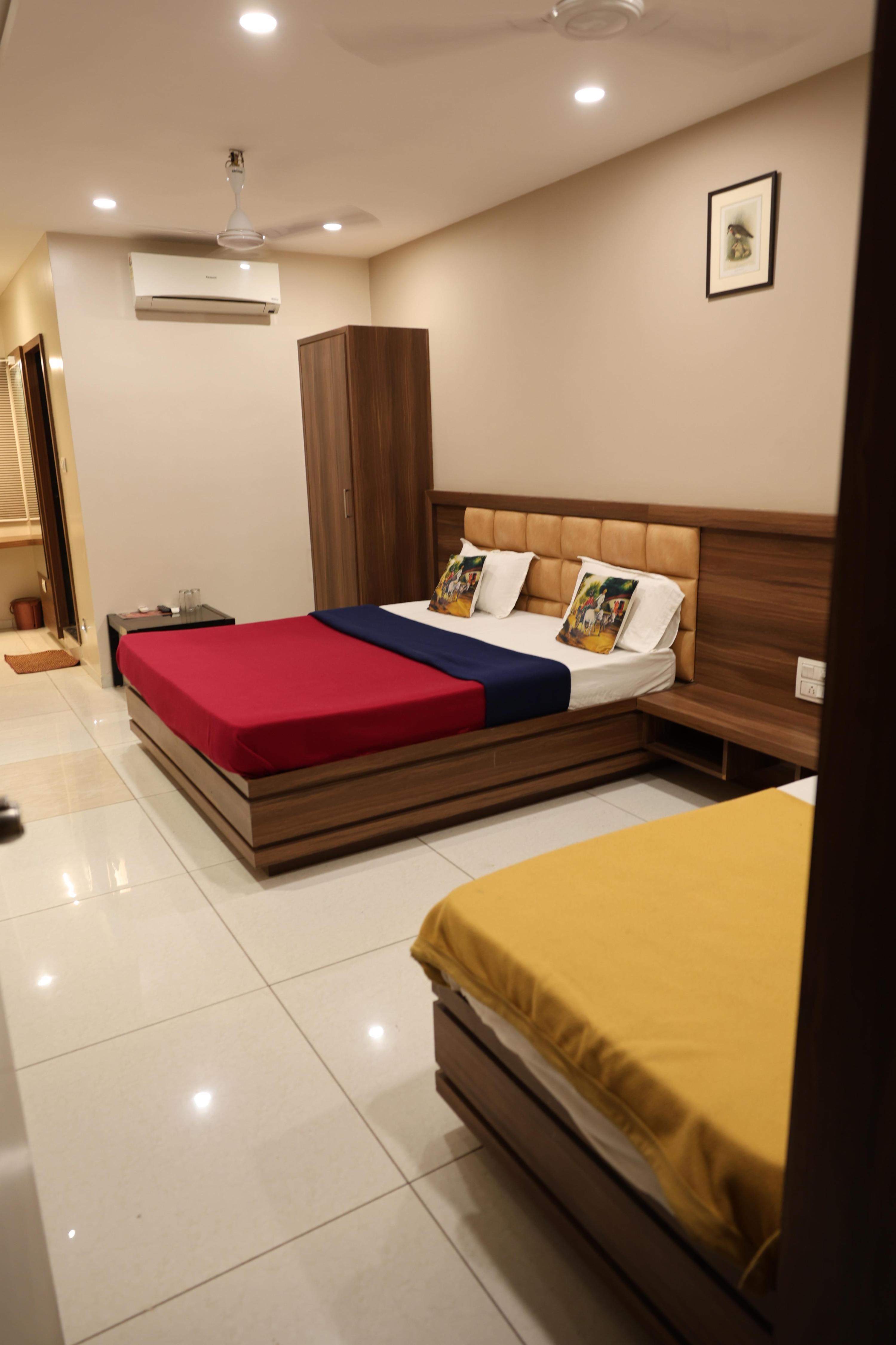 HOTEL SHIV RESIDENCY Room Type - FAMILY ROOM ( 1 Double Bed 1 Single Bed )