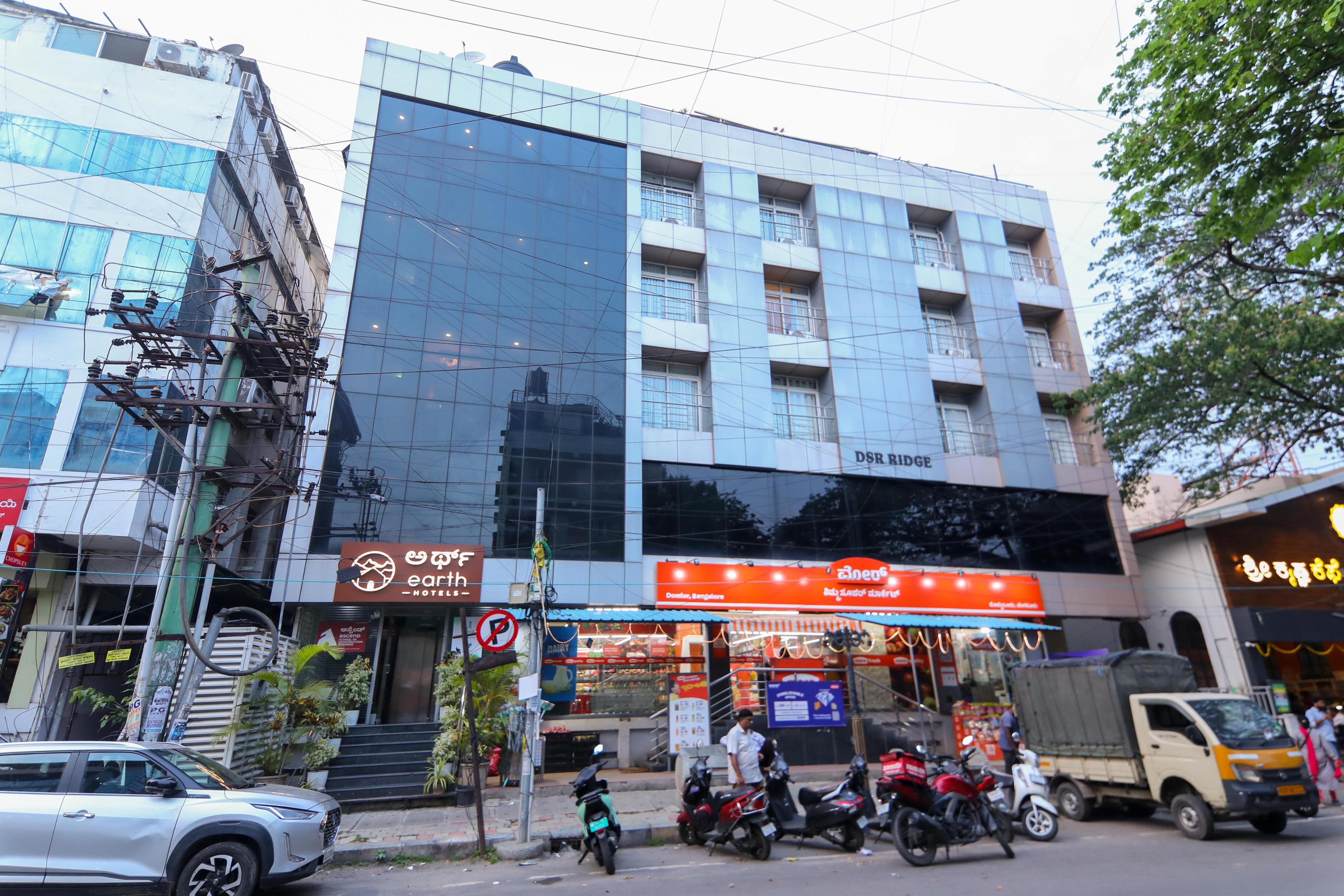 Earth Hotels Domlur - Tap to explore photos
