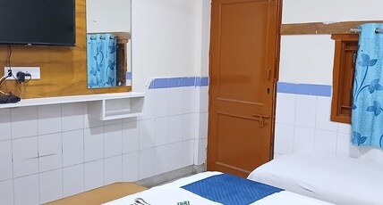YOGESHWAR Room Type - Deluxe Triple Room