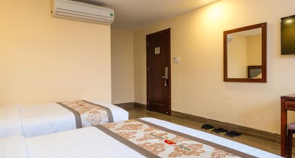 Nhat Minh Hotel and Apartment Room Type - Deluxe Two Queen Beds
