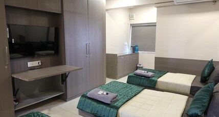 GreenOtel Rooms,Hazira Surat Room Type - Deluxe Triple Room