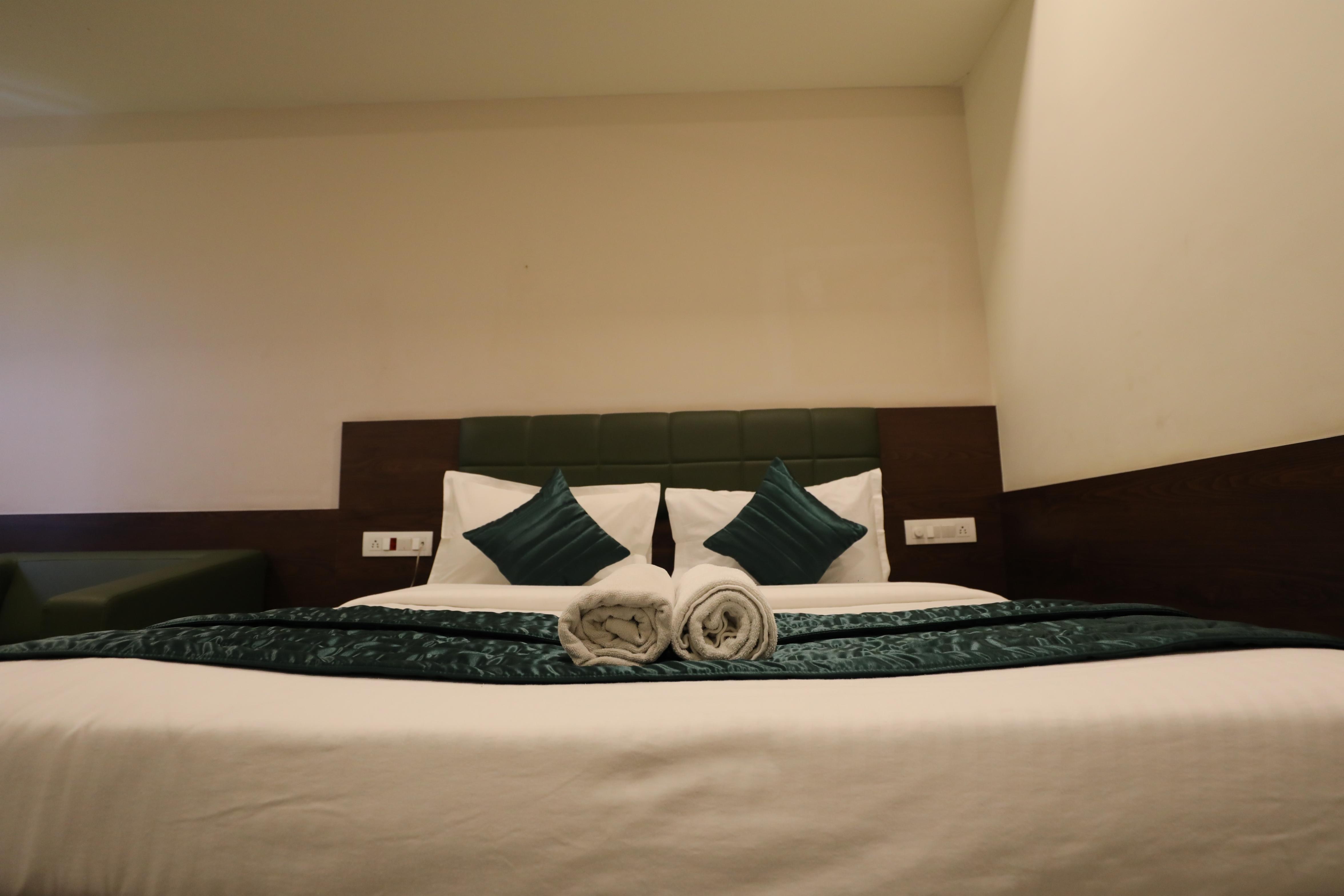 GreenOtel Rooms,Hazira Surat - Tap to explore photos