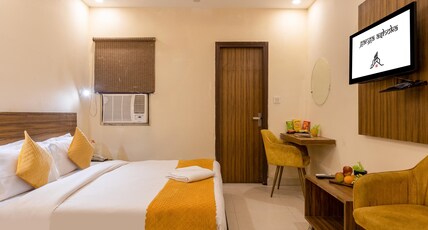 Hotel Ganga Ashoka-stay By The Ganges At Triveni Ghat Room Type - Deluxe Room With Smart TV (2 Adults + 1 Child)