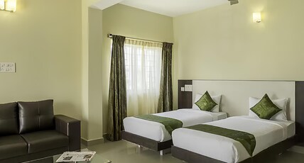 Daffodil Suites at Manyata Tech Park Room Type - Deluxe Room