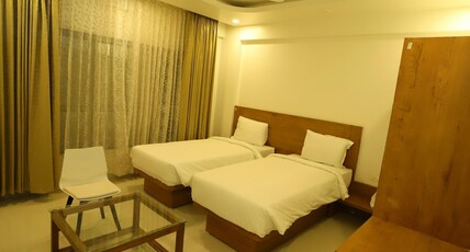 Hotel The Orange Flag - Renuka Enterprises Room Type - Deluxe Twin Bed AC Room Hotel The Orange Flag - Renuka Enterprises Room Type - Deluxe Twin Bed AC Room