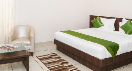 Treebo Durga Boji Grand, Gonikoppal Town Room Type - Deluxe Room Treebo Durga Boji Grand, Gonikoppal Town Room Type - Deluxe Room