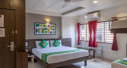 Treebo Shree Sai Suites Room Type - Deluxe Room with Balcony