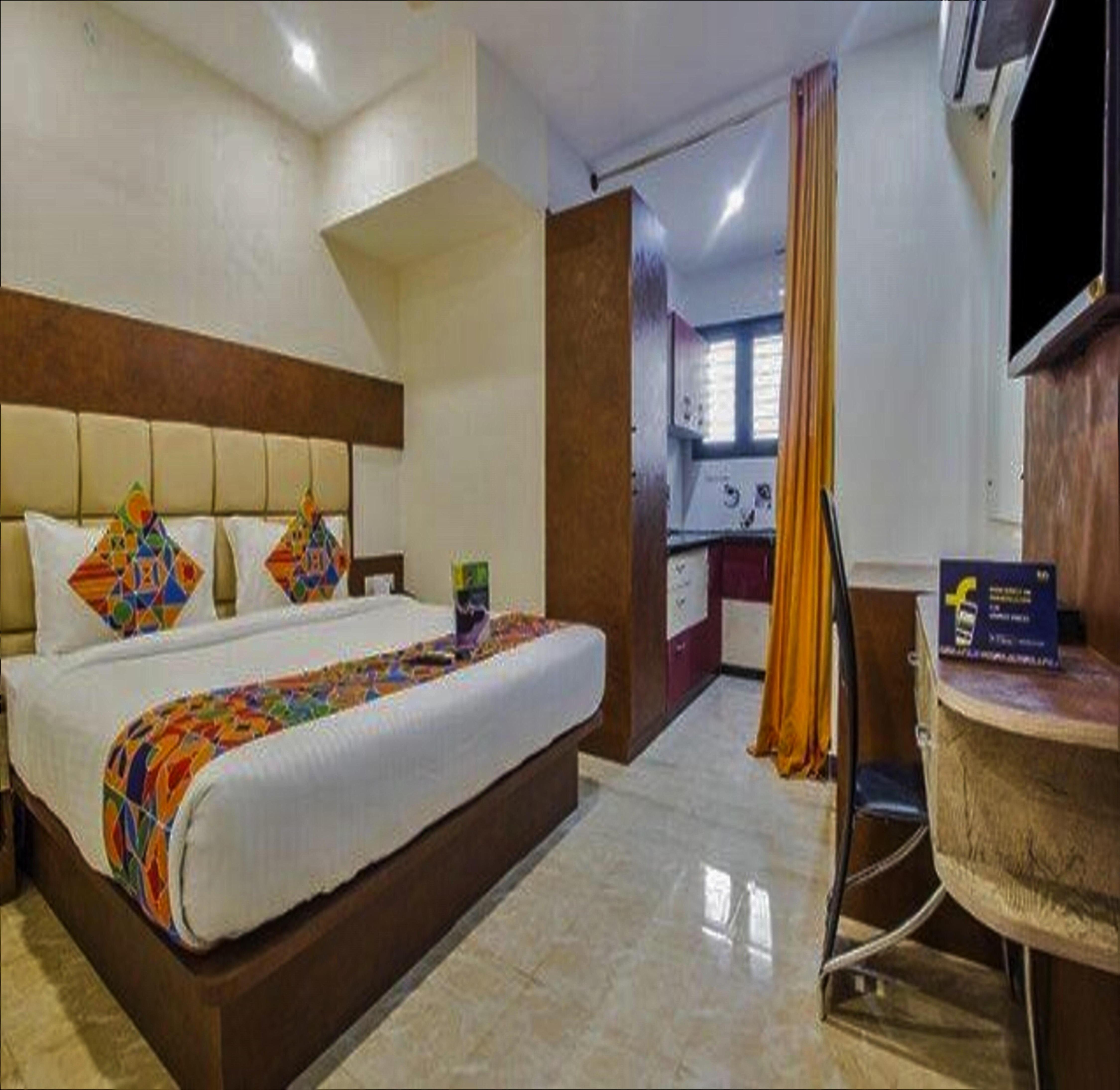 FabHotel Crown Suites - Nr. Sony Signals - Tap to explore photos