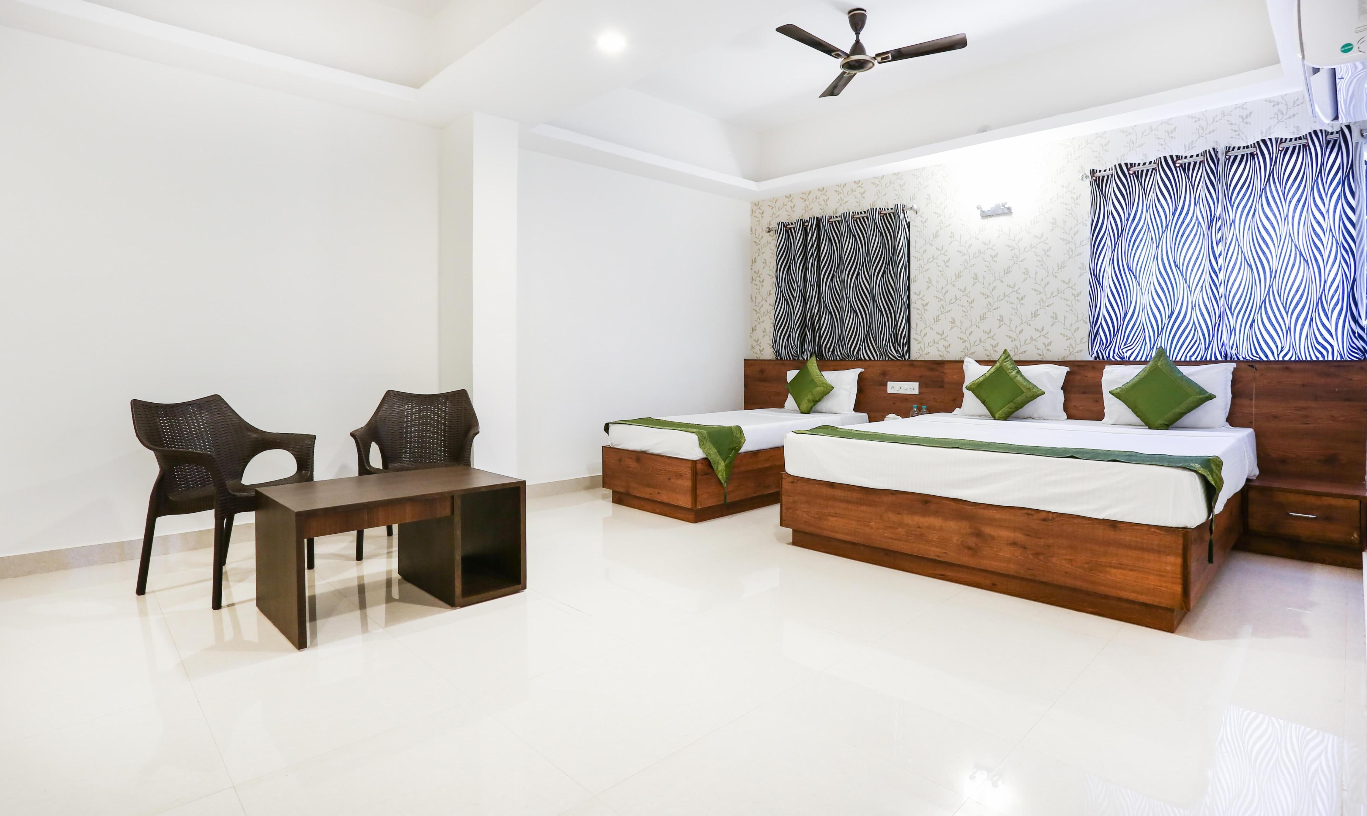 Treebo Comforts Inn, University Road Deralakatte Room Type - Superior Family Room