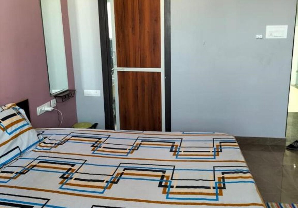 Bedroom shown on public Uphar Homestay listing