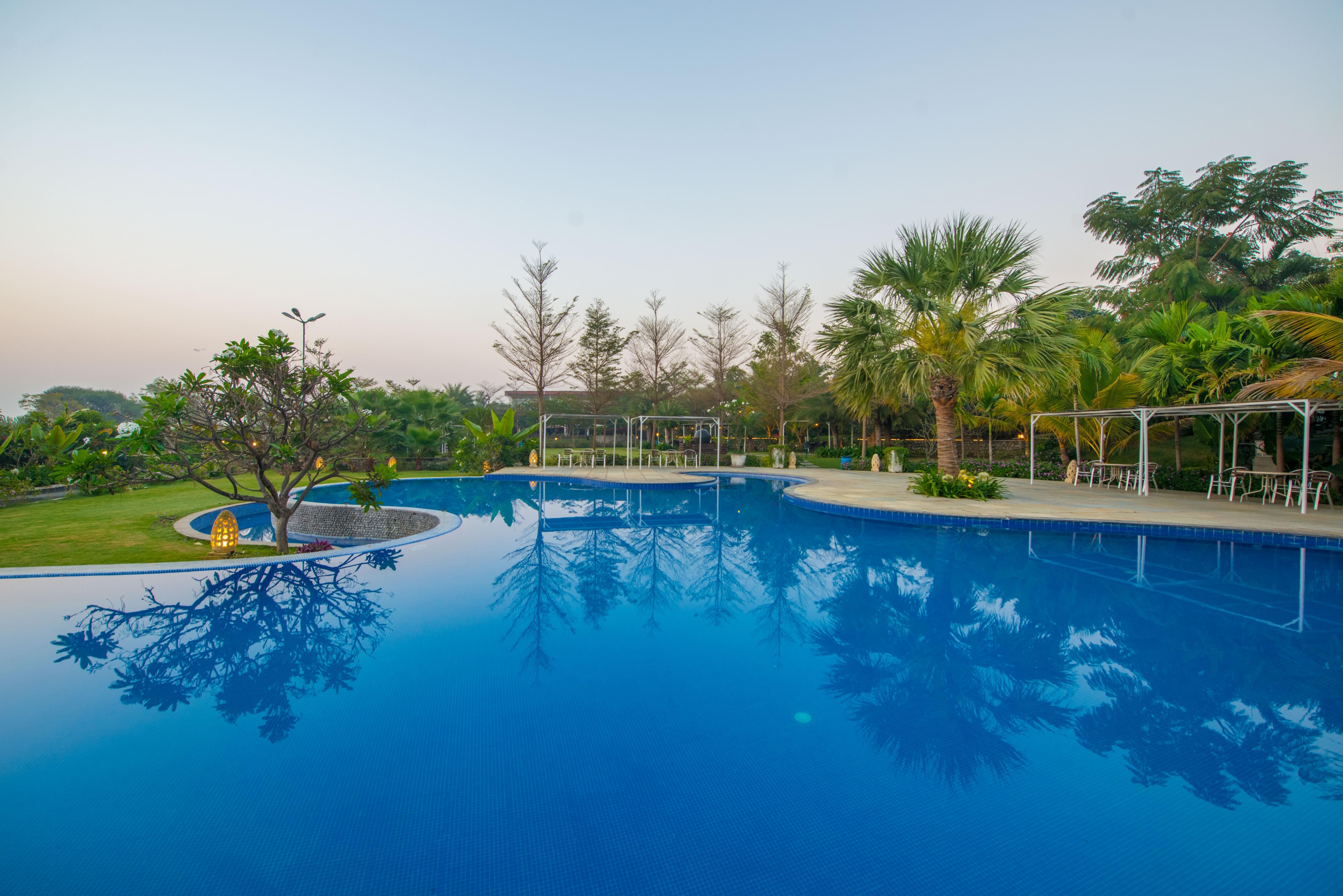 Palm Exotica Resort and Convention Centre - Tap to explore photos
