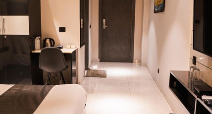 METRO STUDIOS NEAR ARTEMIS HOSPITAL Room Type - Deluxe Room with Private Balcony