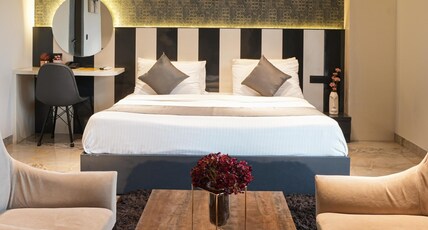 METRO STUDIOS NEAR ARTEMIS HOSPITAL Room Type - Luxury Room with Kitchenette and  Private Balcony