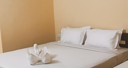 Radhika Inn Room Type - Deluxe Room