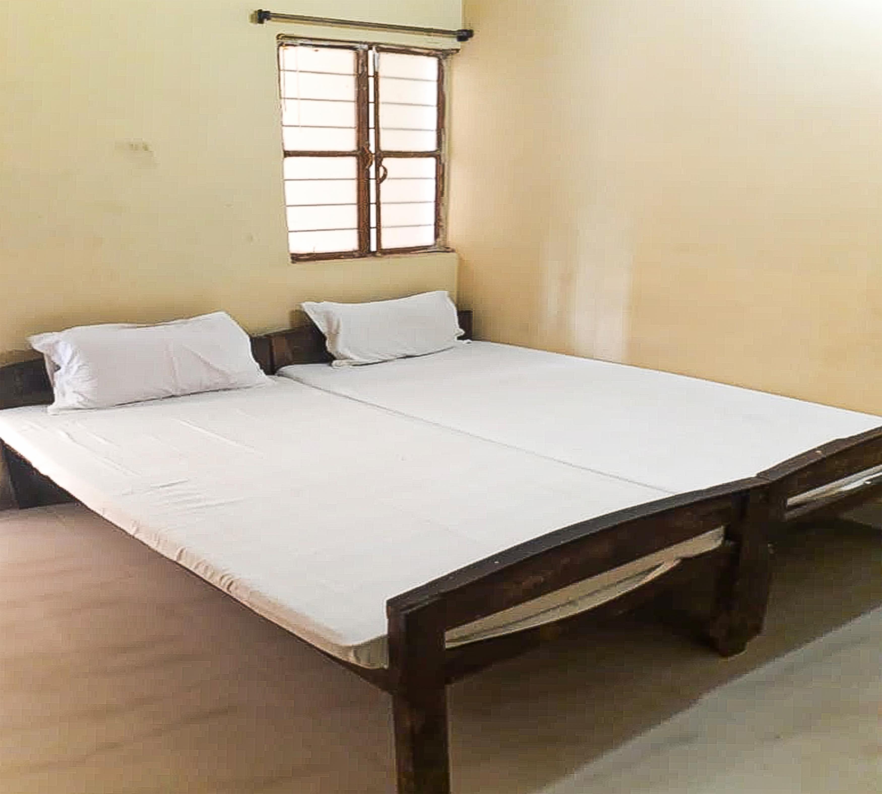 Puja Guest House By WB Inn - Tap to explore photos