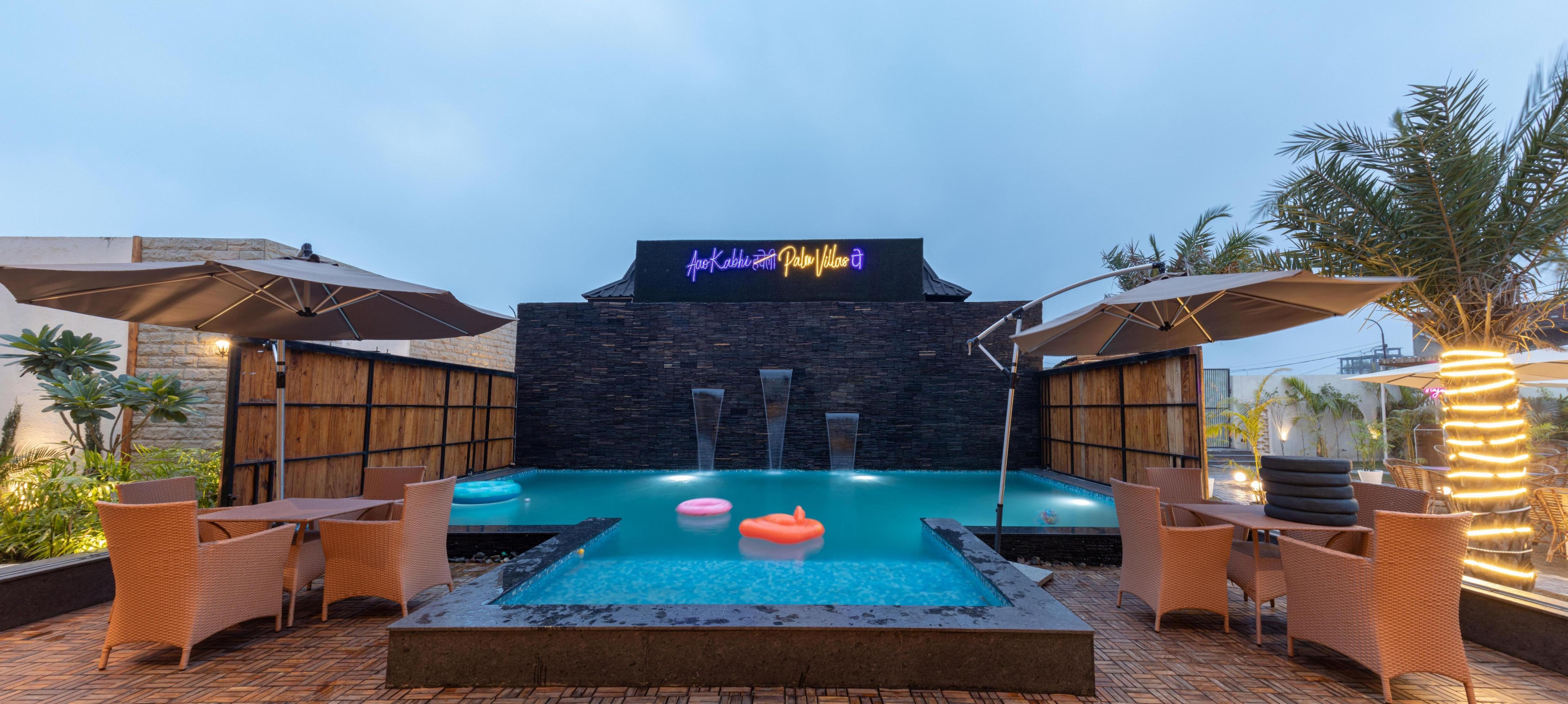 Palm 1 bhk Apartment | Pool, Lounge & Garden Caf - Tap to explore photos