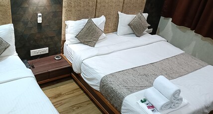 Hotel RJ Residency C.G. Road Room Type - Deluxe Family Room( 1 Double + 1 Single Bed) Hotel RJ Residency C.G. Road Room Type - Deluxe Family Room( 1 Double + 1 Single Bed)