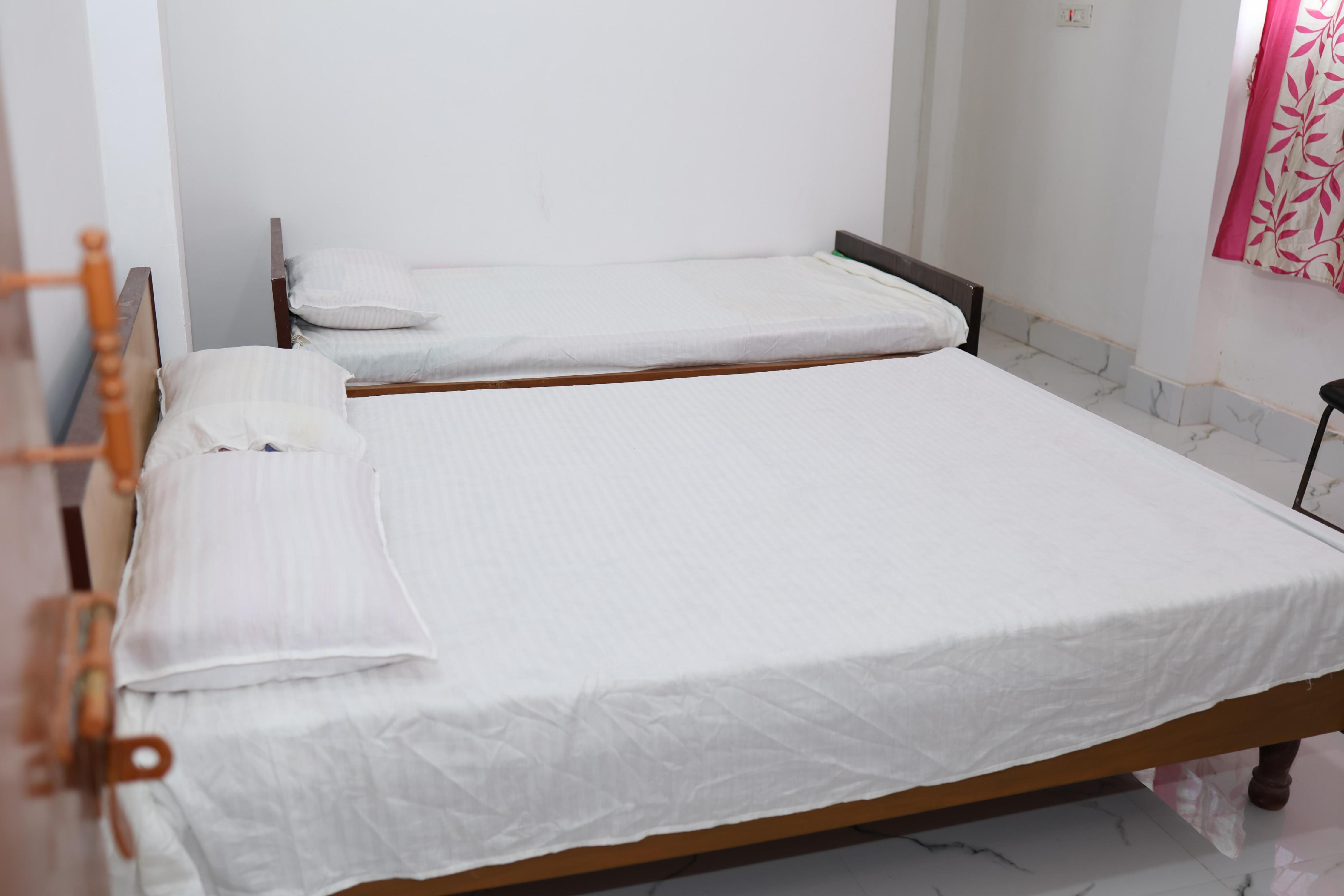 Kriya Yoga Wellness Room Type - Four bedded attached bathroom